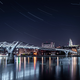 In this multi-exposure picture, the London Millennium Footbridge is illuminated under the stars on a clear night on April 21, 2020 in London. The clear skies created by the new moon coincide with the Lyrid meteor shower, an annual display caused by the Earth passing through a cloud of debris from a comet called C/186 Thatcher.